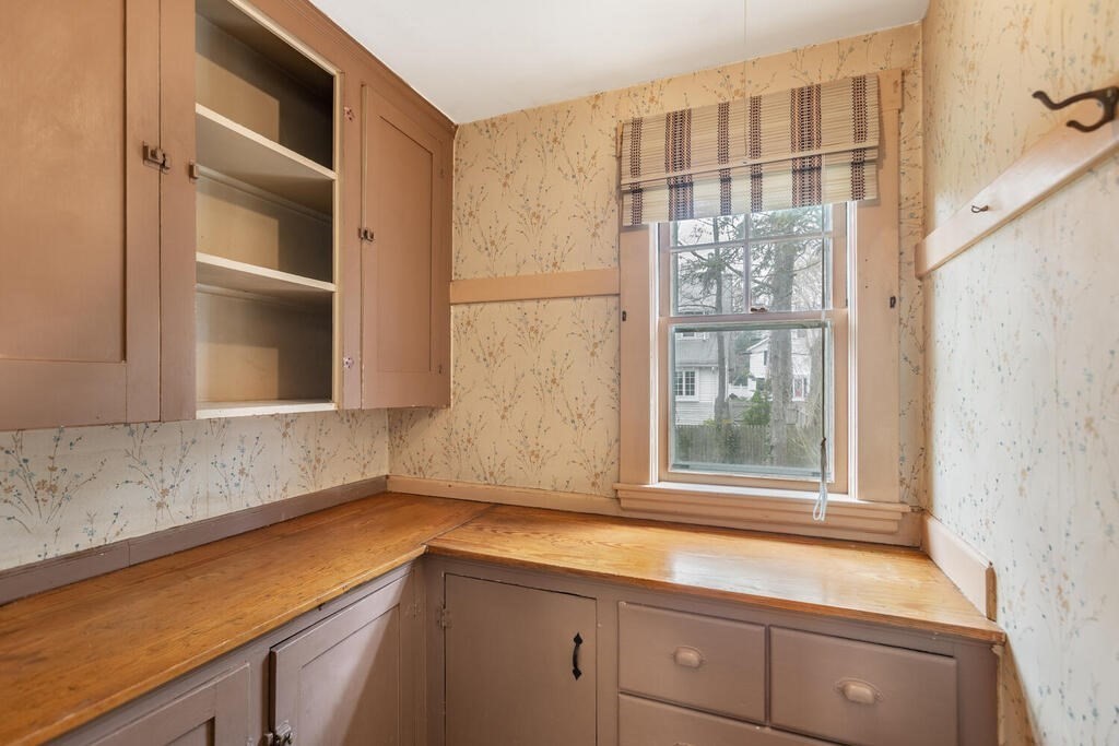 145 Robbins Road Arlington, MA 02476 - Photo 16 of 31 a kitchen with a sink and a window