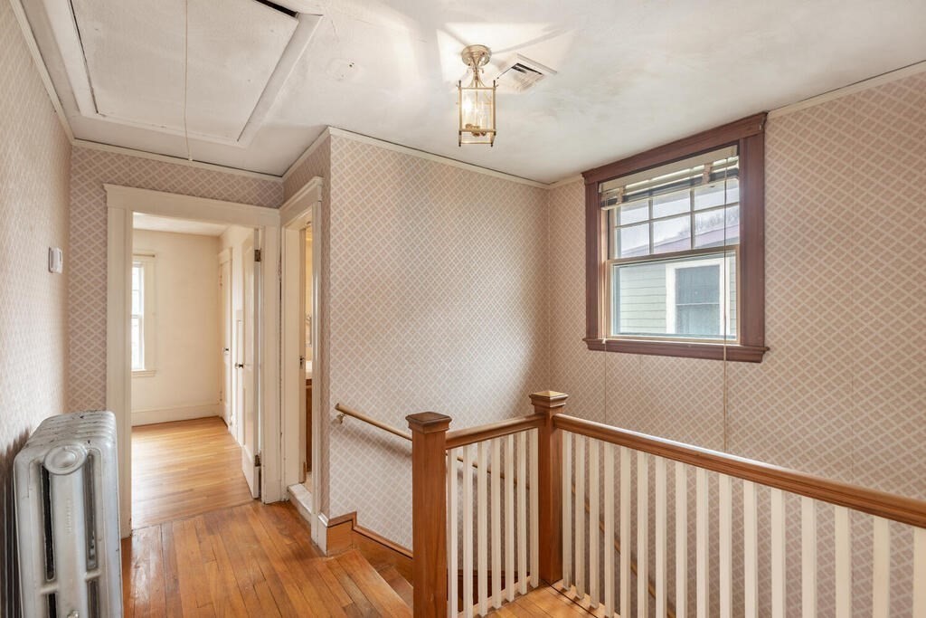 145 Robbins Road Arlington, MA 02476 - Photo 20 of 31 a view of a hallway with wooden floor and staircase