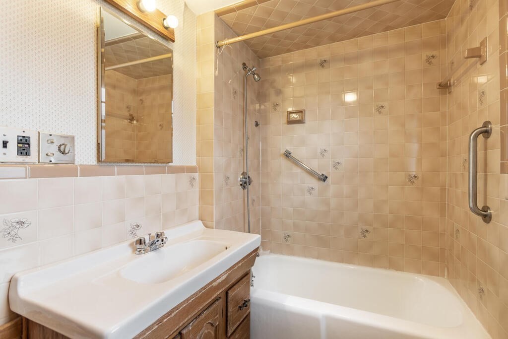 145 Robbins Road Arlington, MA 02476 - Photo 26 of 31 a bathroom with a sink and a bathtub