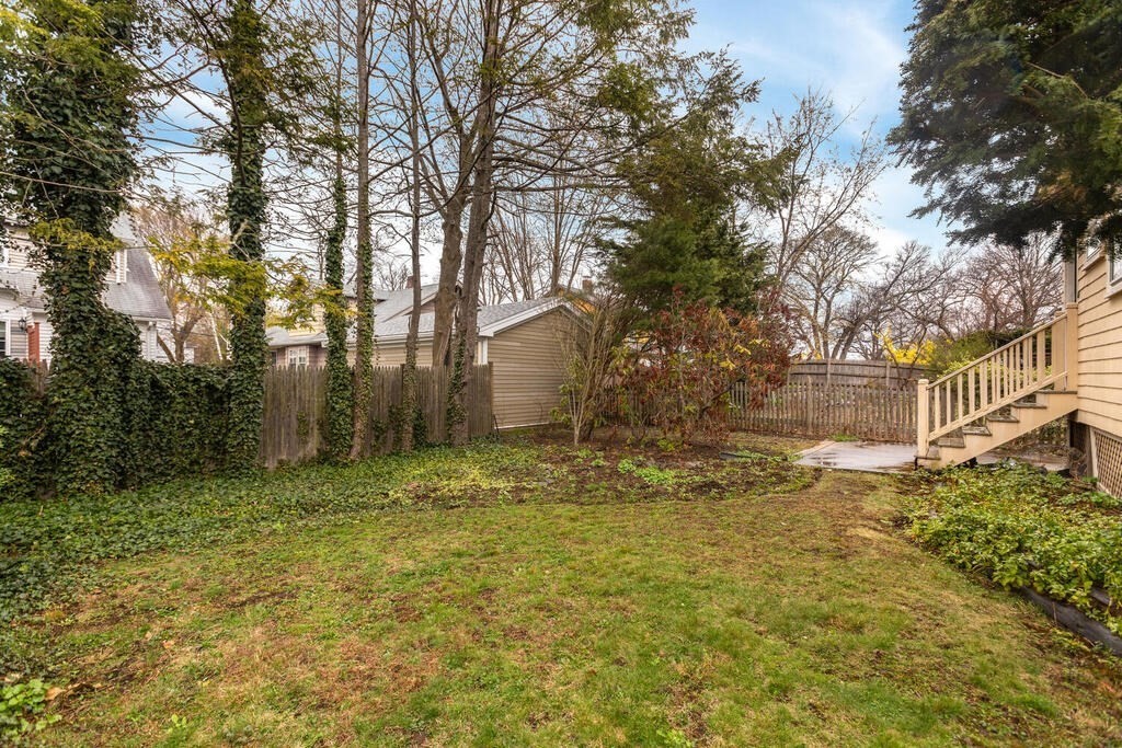 145 Robbins Road Arlington, MA 02476 - Photo 29 of 31 a backyard of a house with lots of green space