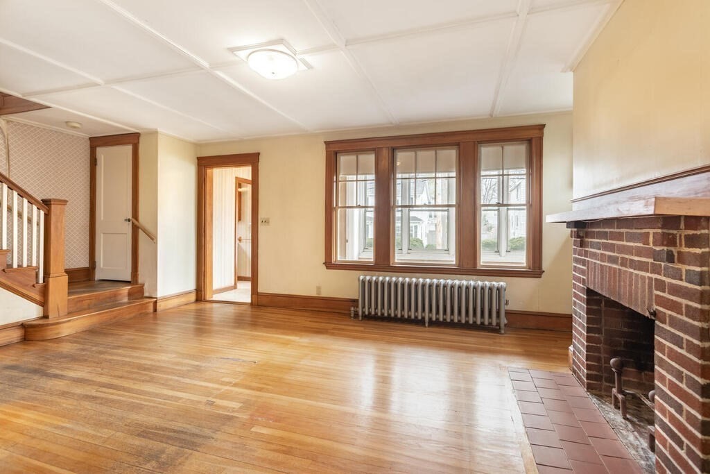 145 Robbins Road Arlington, MA 02476 - Photo 5 of 31 an empty room with wooden floor and windows