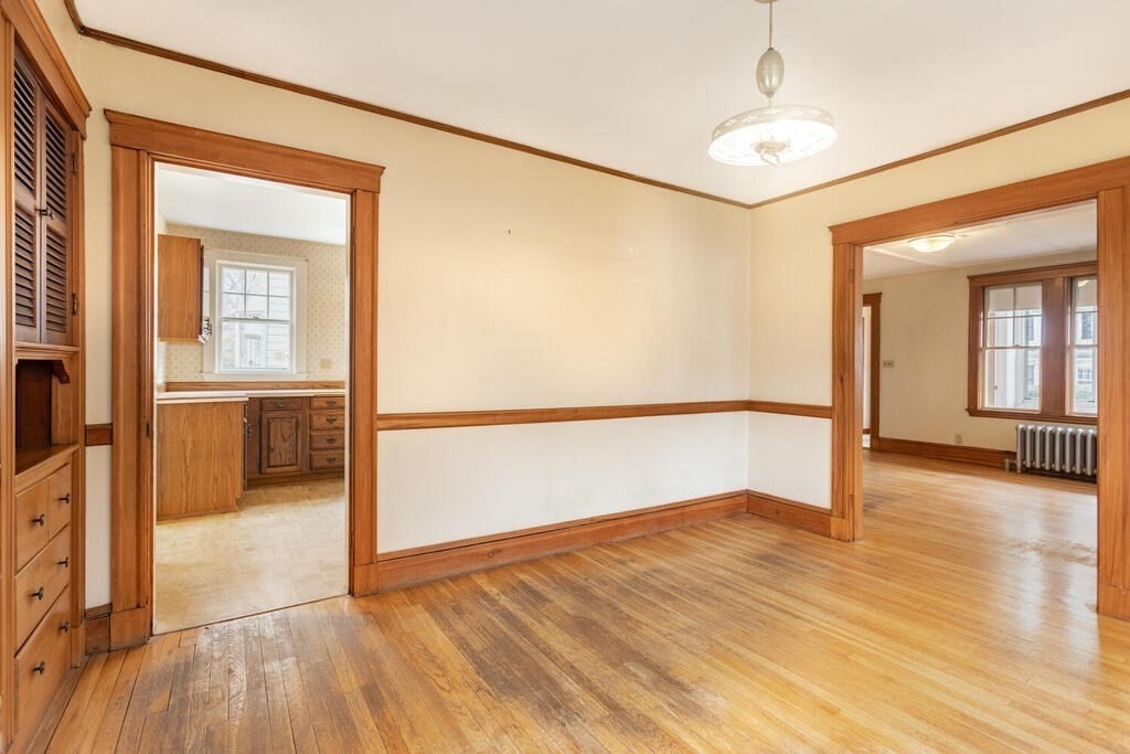 145 Robbins Road Arlington, MA 02476 - Photo 10 of 31 wooden floor in an empty room with a window