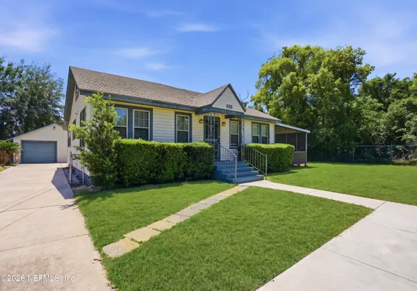 a front view of a house with a yard