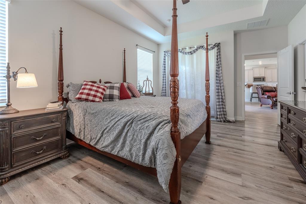 9224 Southwest 60th Ct Road Ocala, FL 34476 - Photo 28 of 55 a bedroom with a bed and wooden floor