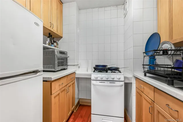 a bedroom with a bed and a wooden floor