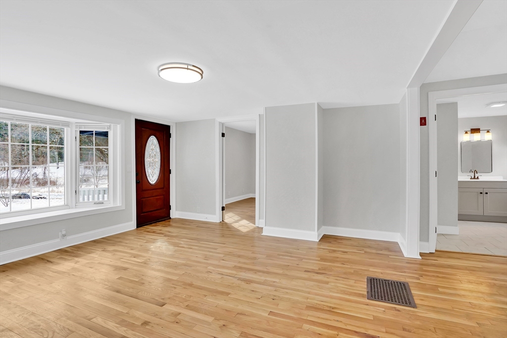 273 Dunhamtown Palmer Road Brimfield, MA 01010 - Photo 13 of 42 a view of an empty room with wooden floor and a window