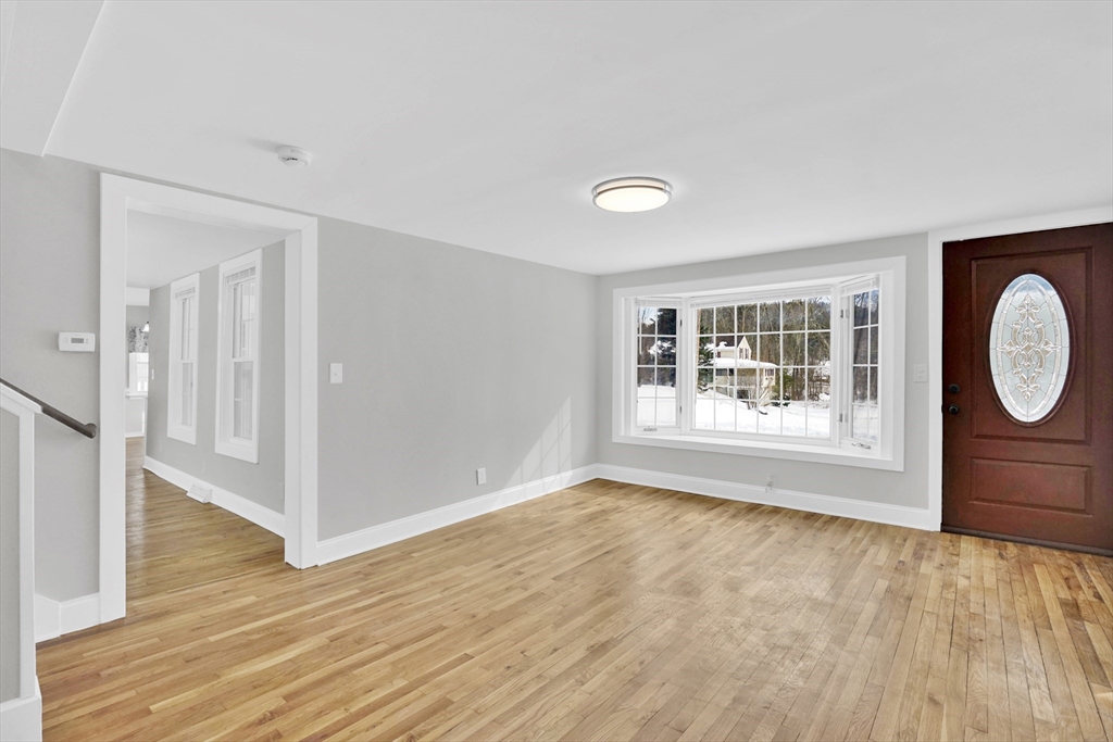 273 Dunhamtown Palmer Road Brimfield, MA 01010 - Photo 14 of 42 a view of empty room with wooden floor and fan
