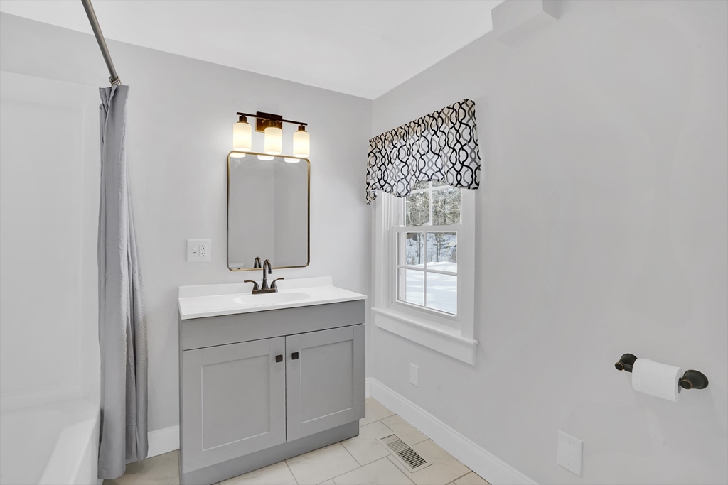 273 Dunhamtown Palmer Road Brimfield, MA 01010 - Photo 15 of 42 a bathroom with a sink and a mirror
