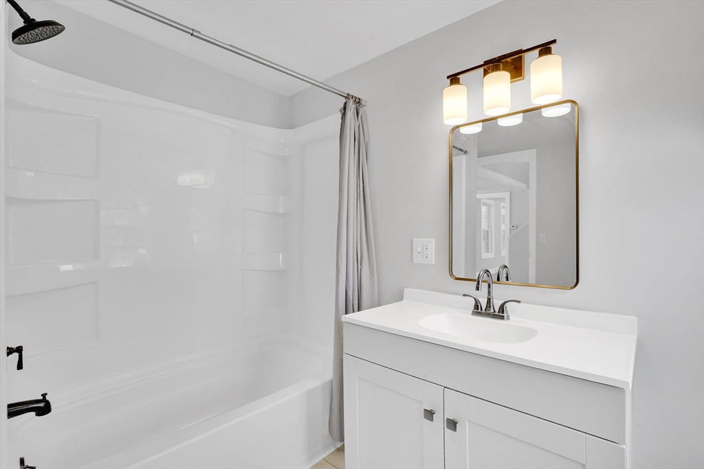 273 Dunhamtown Palmer Road Brimfield, MA 01010 - Photo 16 of 42 a bathroom with a sink and a mirror