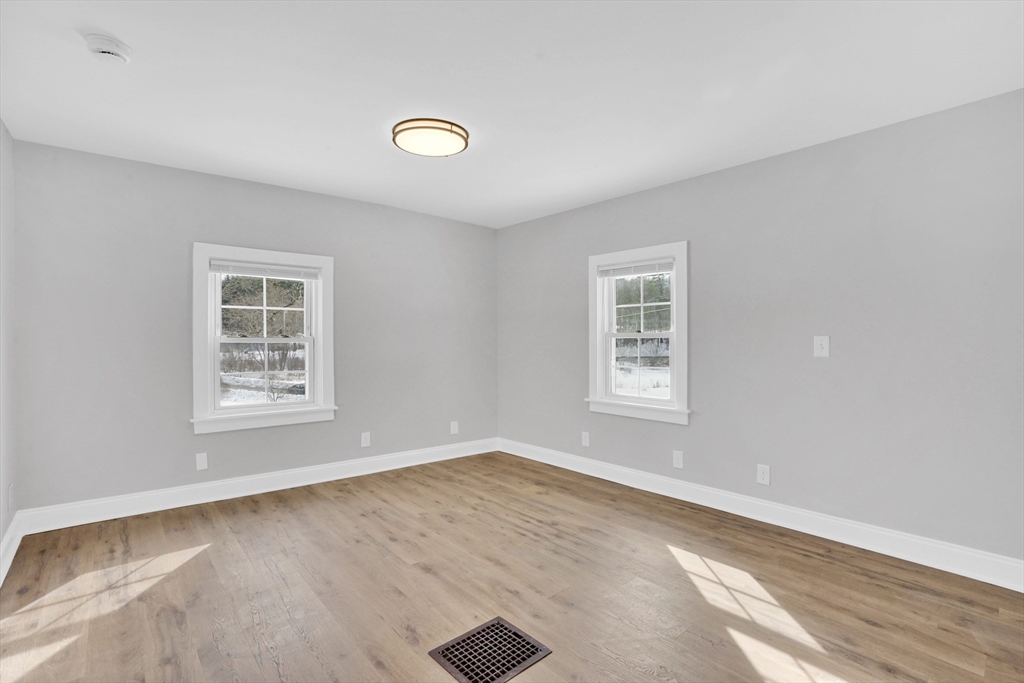 273 Dunhamtown Palmer Road Brimfield, MA 01010 - Photo 17 of 42 a view of a big room with windows