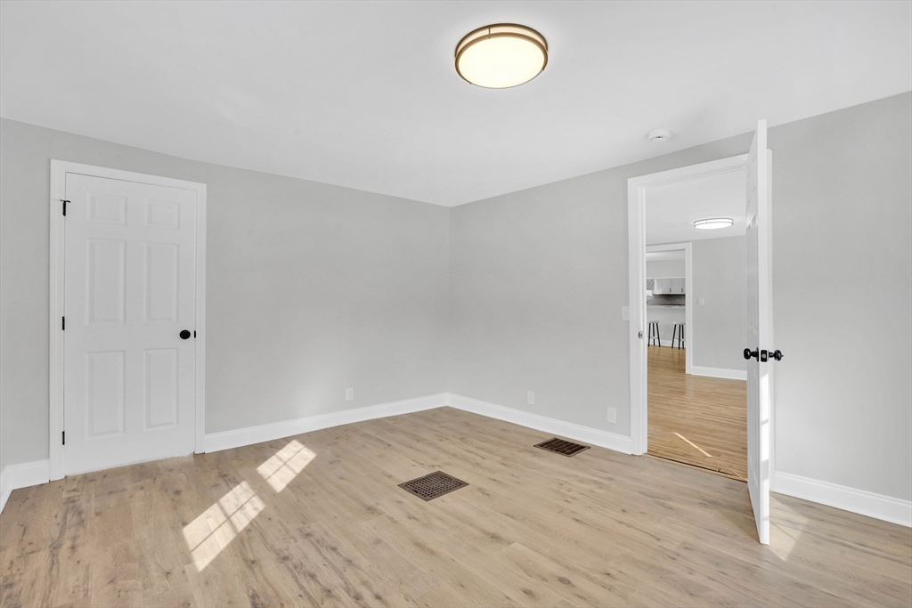 273 Dunhamtown Palmer Road Brimfield, MA 01010 - Photo 18 of 42 a view of empty room with wooden floor