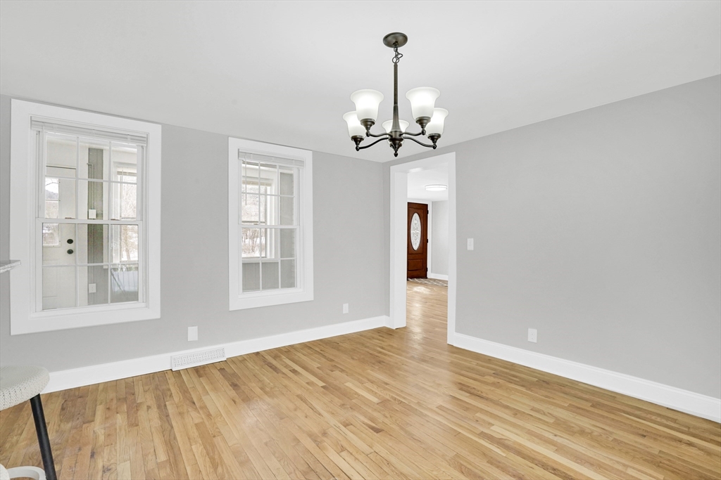 273 Dunhamtown Palmer Road Brimfield, MA 01010 - Photo 21 of 42 a view of empty room with wooden floor and window