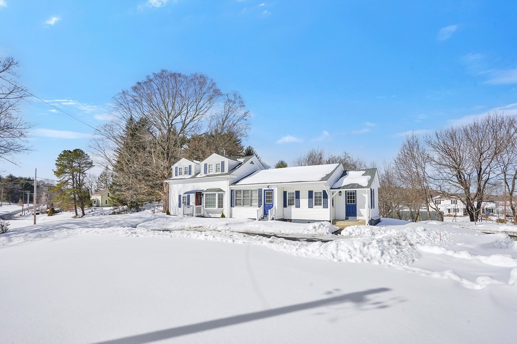 273 Dunhamtown Palmer Road Brimfield, MA 01010 - Photo 3 of 42 a front view of a building with a yard