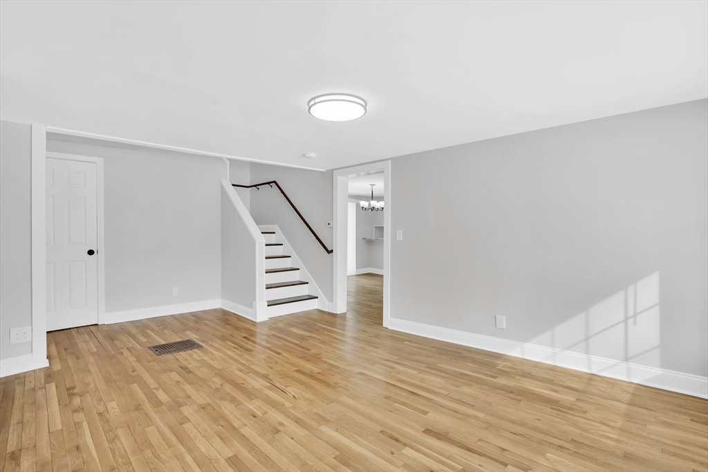 273 Dunhamtown Palmer Road Brimfield, MA 01010 - Photo 10 of 42 a view of a hallway with wooden floor and staircase