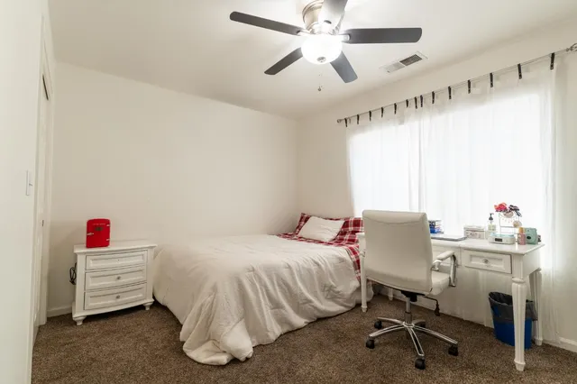 a bedroom with a bed and furniture