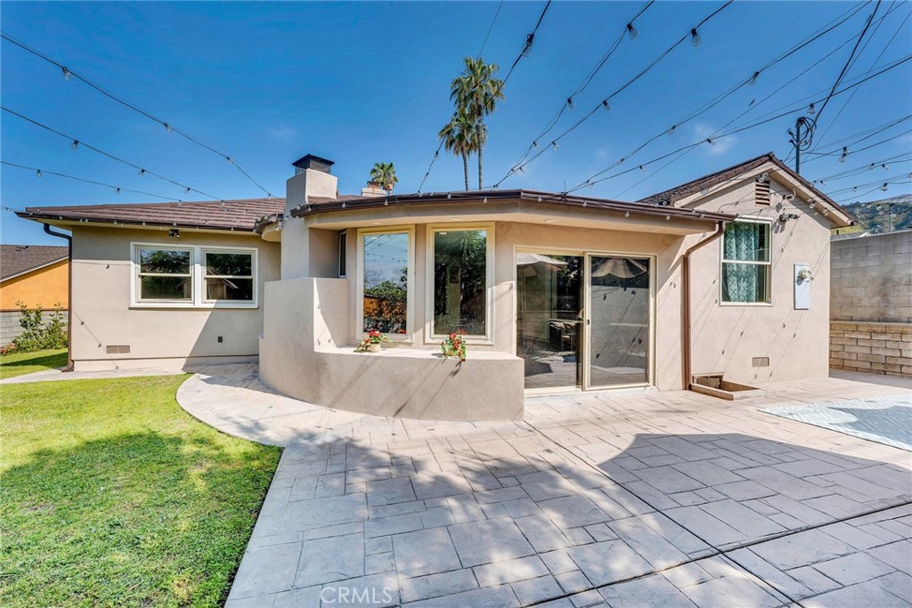 818 Bethany Road Burbank, CA 91504 - Photo 7 of 23 a front view of a house with a yard and seating space