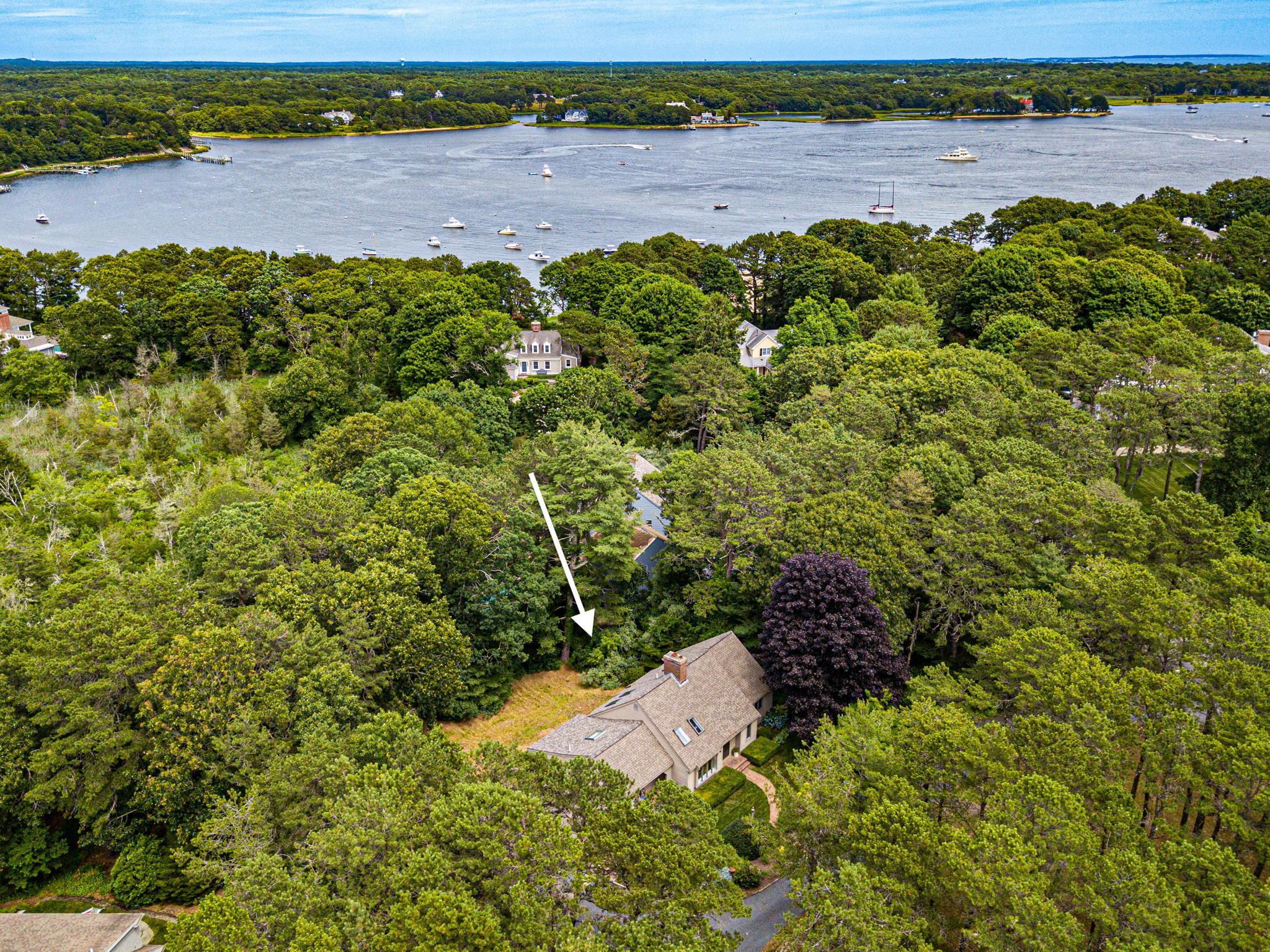 40 Point Isabella Road Cotuit, MA 02635 - Photo 1 of 28 a view of a garden with a lake