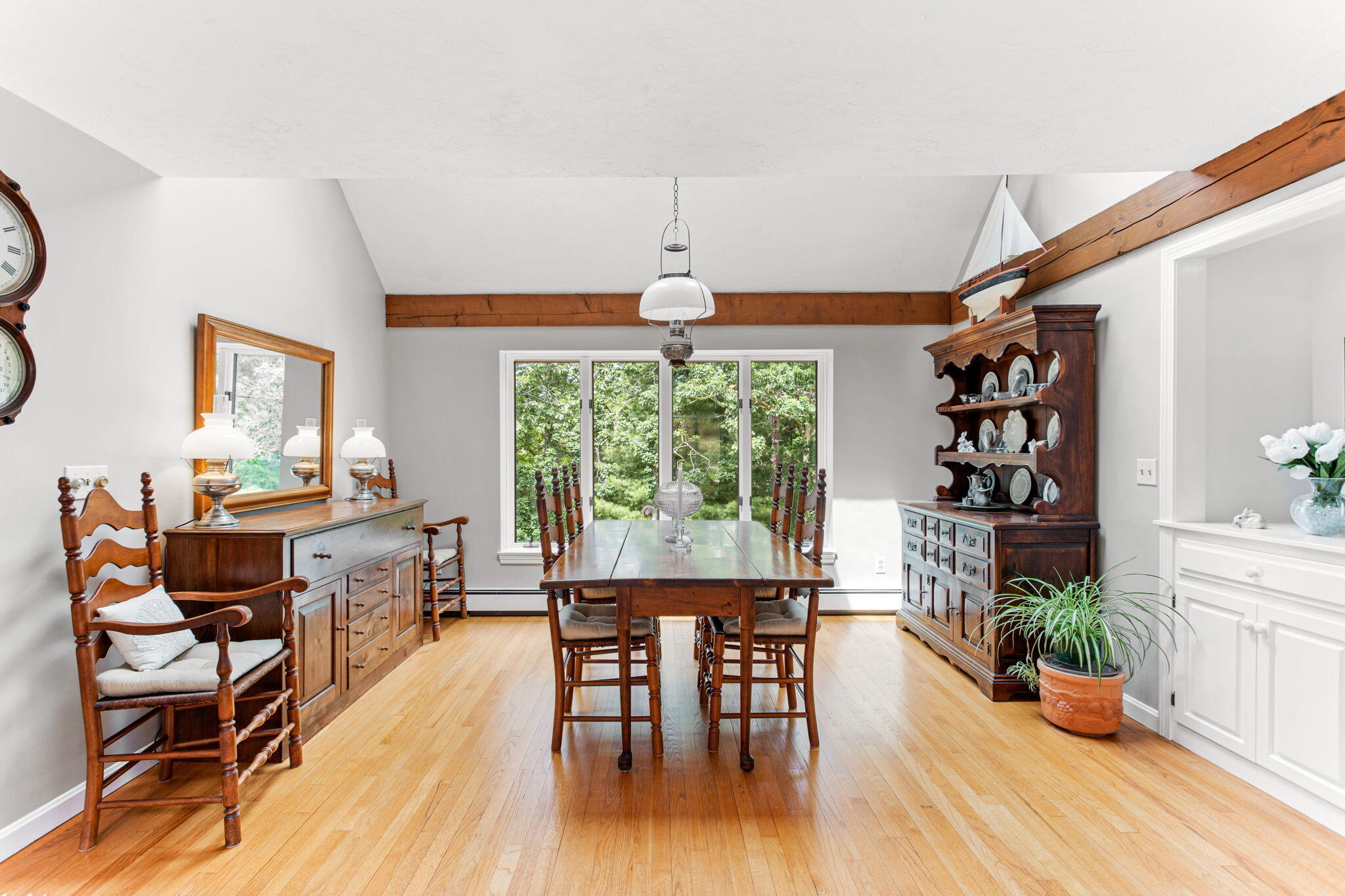 40 Point Isabella Road Cotuit, MA 02635 - Photo 12 of 28 a view of a dining room with furniture window and wooden floor