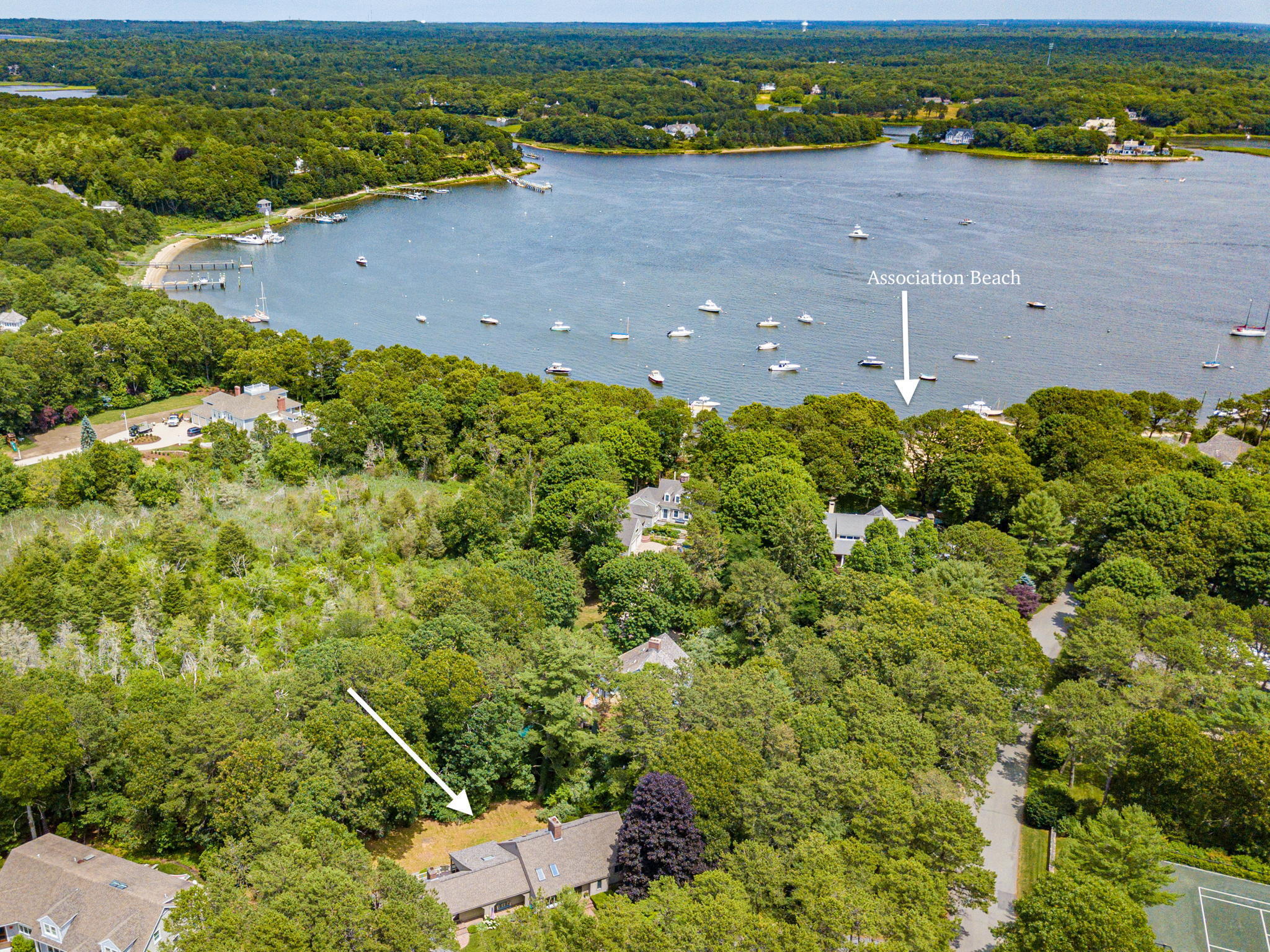 40 Point Isabella Road Cotuit, MA 02635 - Photo 2 of 28 an aerial view of a houses with a lake view