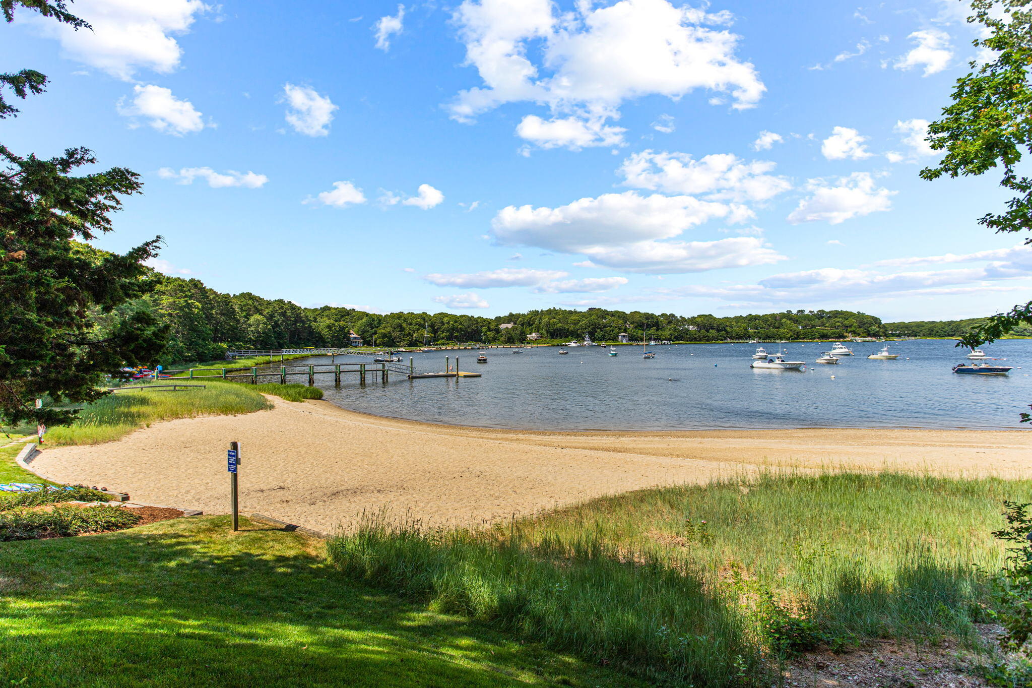 40 Point Isabella Road Cotuit, MA 02635 - Photo 28 of 28 a view of a lake with houses in the back