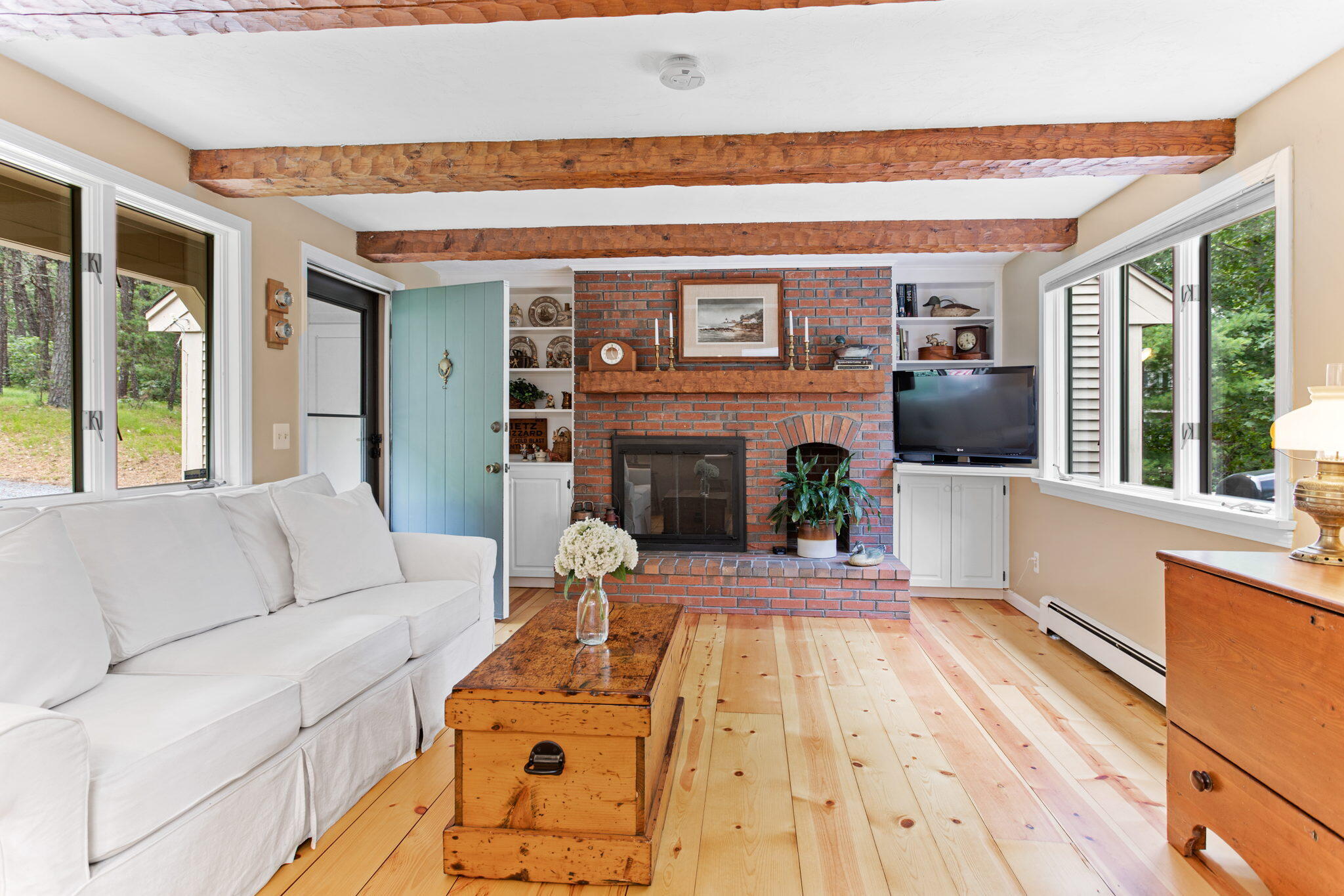 40 Point Isabella Road Cotuit, MA 02635 - Photo 5 of 28 a living room with furniture and a fireplace