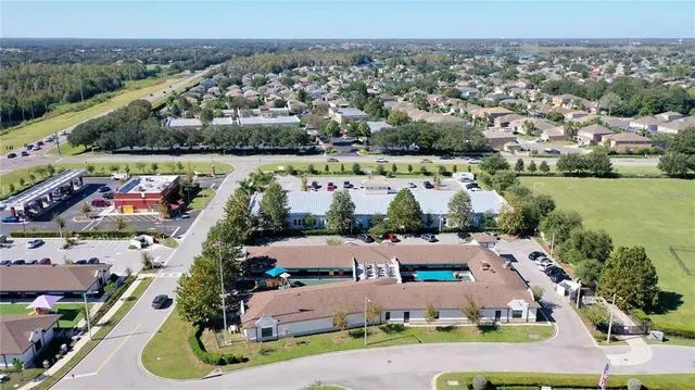 an aerial view of a house with a garden