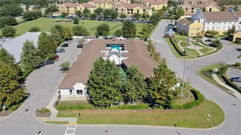 an aerial view of a house with outdoor space lake view