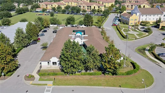 an aerial view of a house with outdoor space lake view