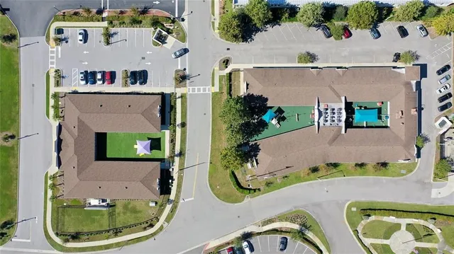 an aerial view of a house with a swimming pool