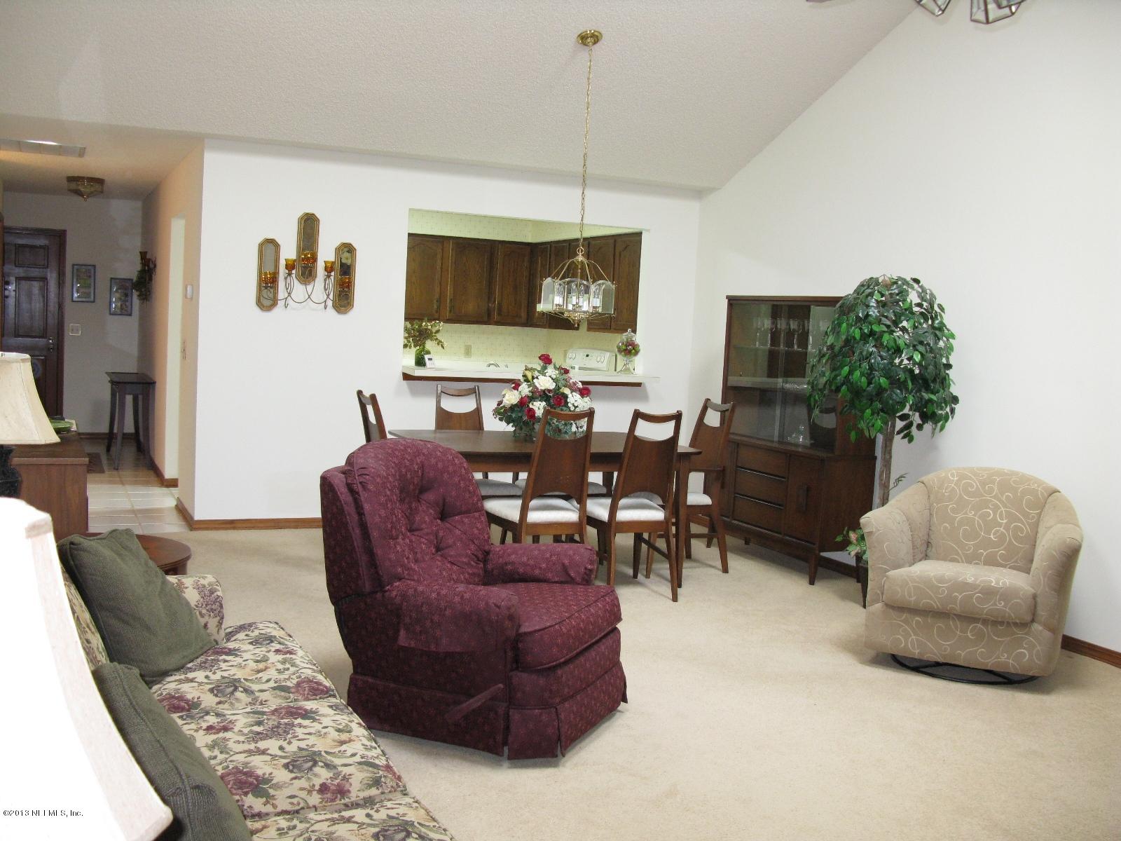 11285 Sawmill Road Jacksonville, FL 32225 - Photo 8 of 20 a living room with furniture and a flat screen tv