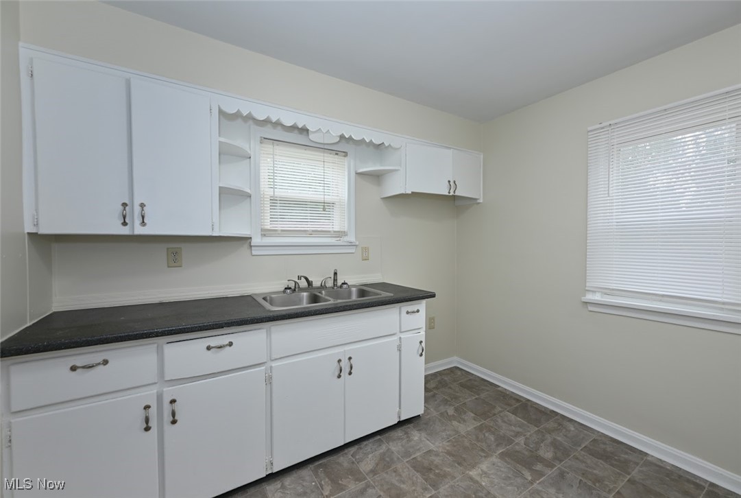 897 Reed Avenue Akron, OH 44306 - Photo 12 of 33 Kitchen with white cabinets and sink