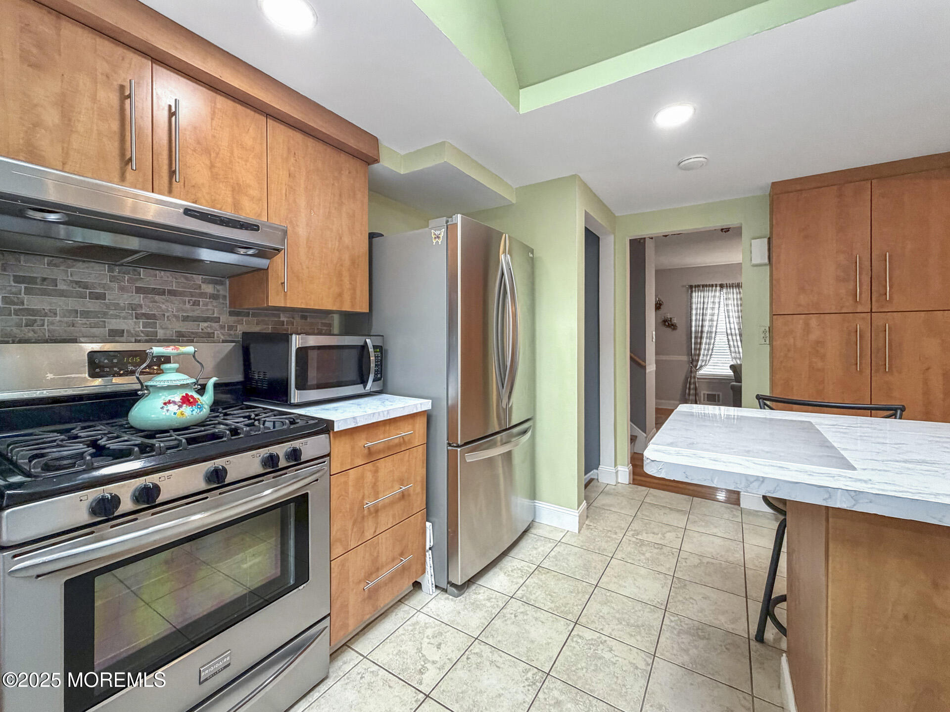 17 North Longview Road Howell, NJ 07731 - Photo 17 of 30 a kitchen with stainless steel appliances granite countertop a stove a refrigerator and a cabinets