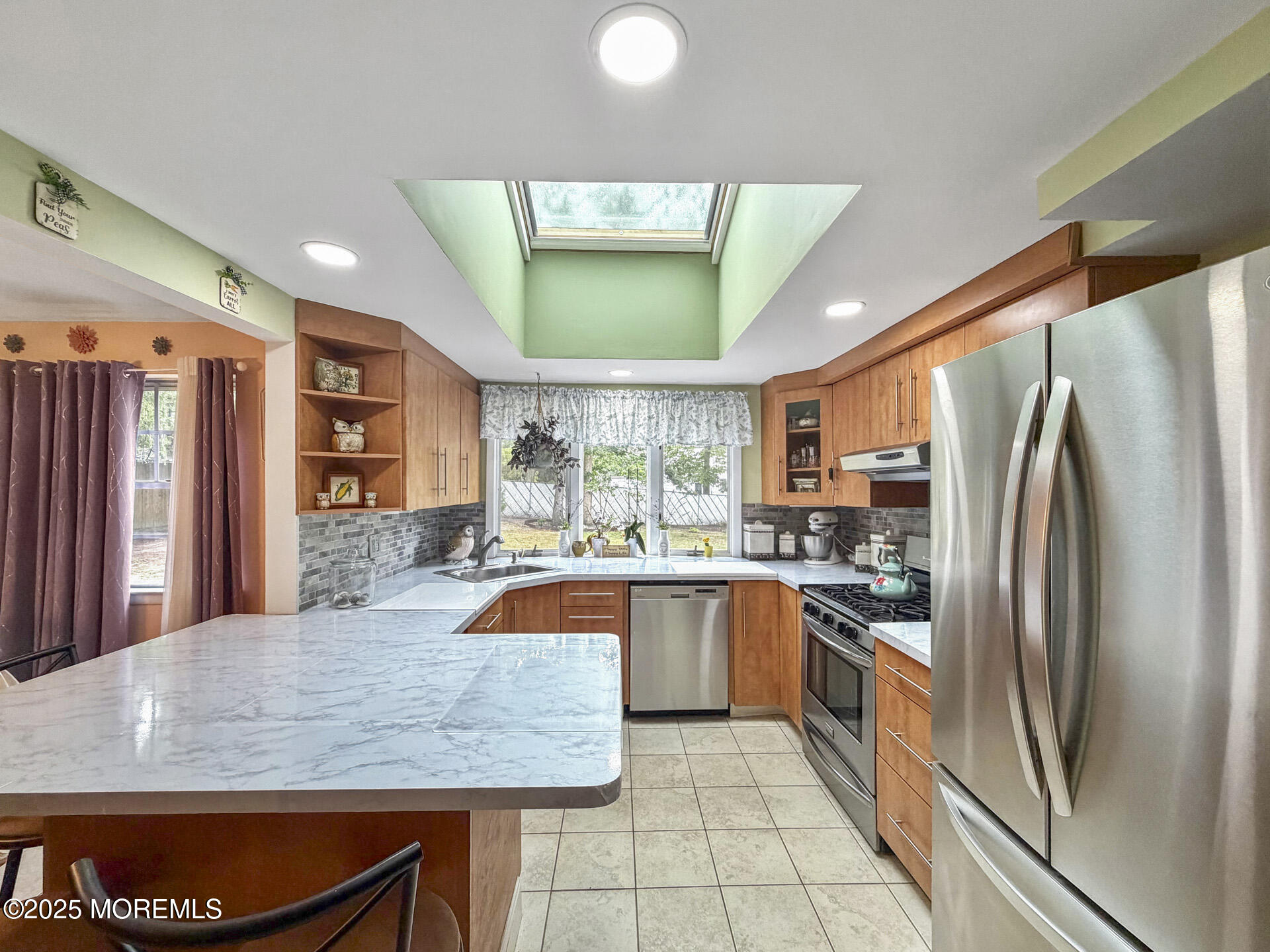 17 North Longview Road Howell, NJ 07731 - Photo 18 of 30 a kitchen with stainless steel appliances granite countertop a refrigerator a sink a stove and island