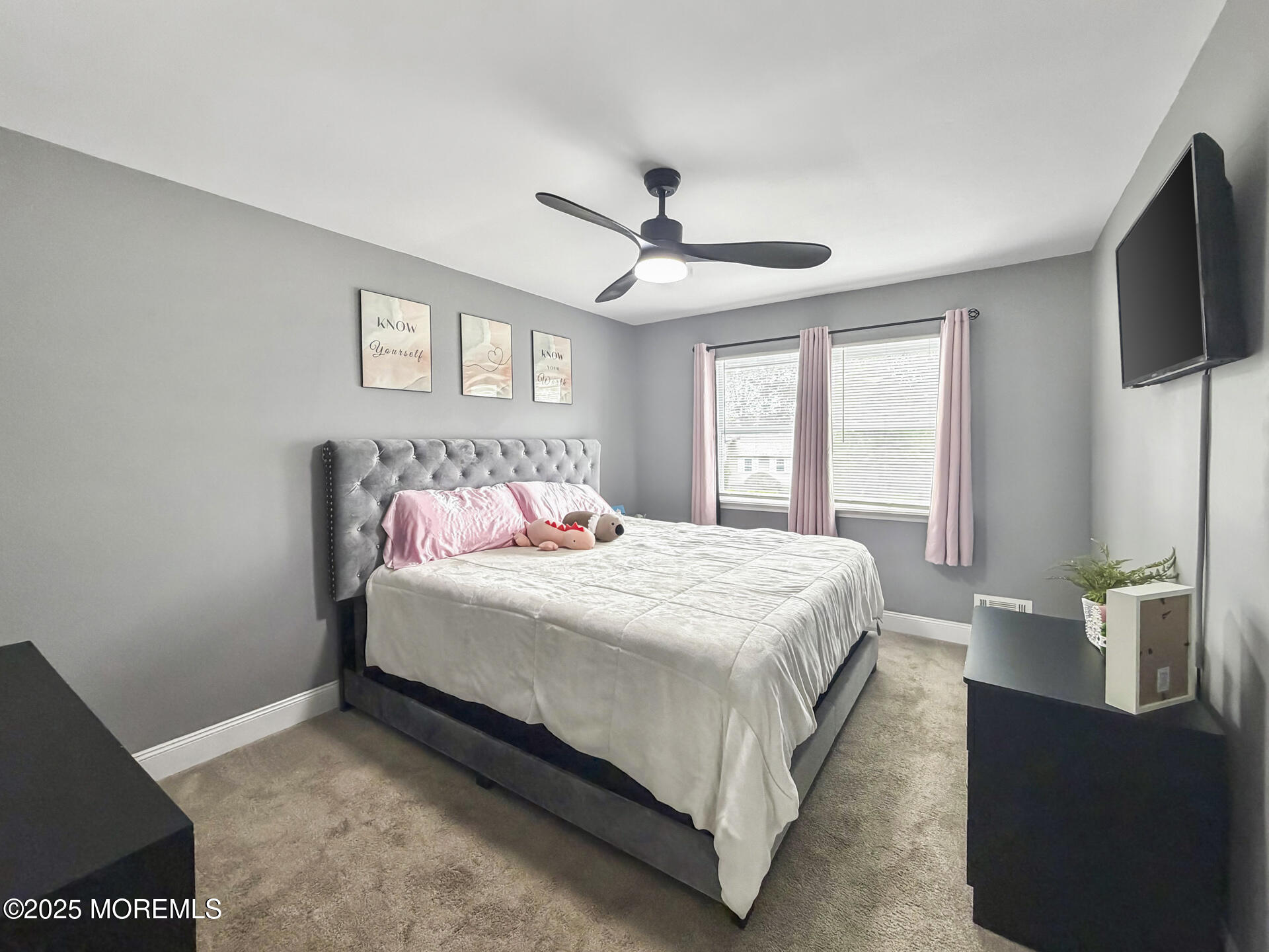 17 North Longview Road Howell, NJ 07731 - Photo 23 of 30 a bedroom with a bed flat screen tv and a window