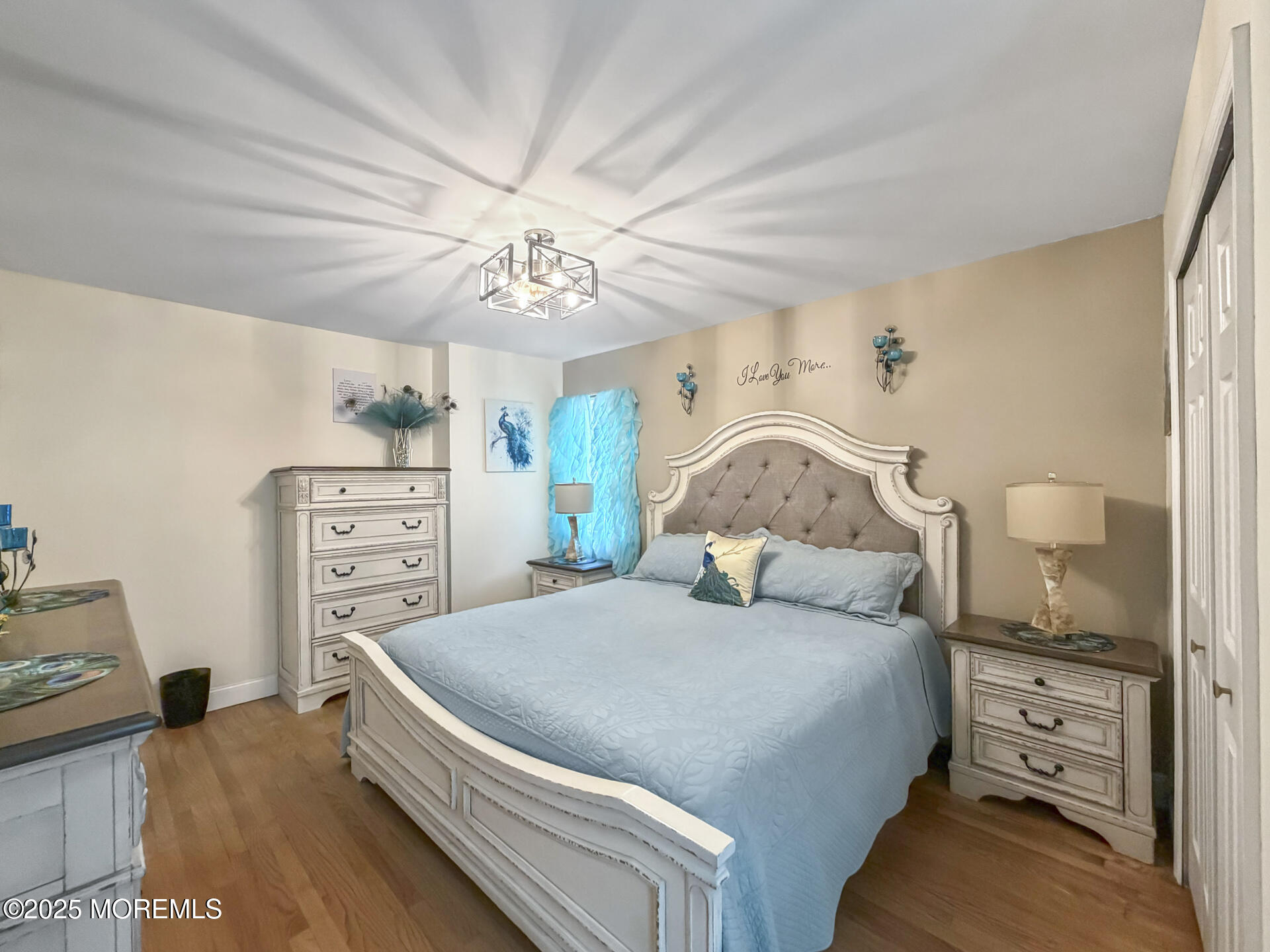 17 North Longview Road Howell, NJ 07731 - Photo 24 of 30 a bedroom with a bed and a chandelier