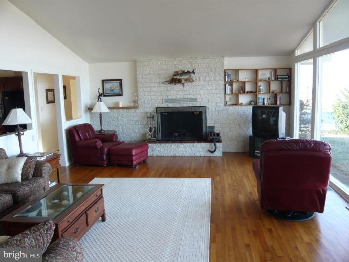 1158 River Bay Road Annapolis, MD 21409 - Photo 10 of 23 Great Room interior with brick wall fireplace