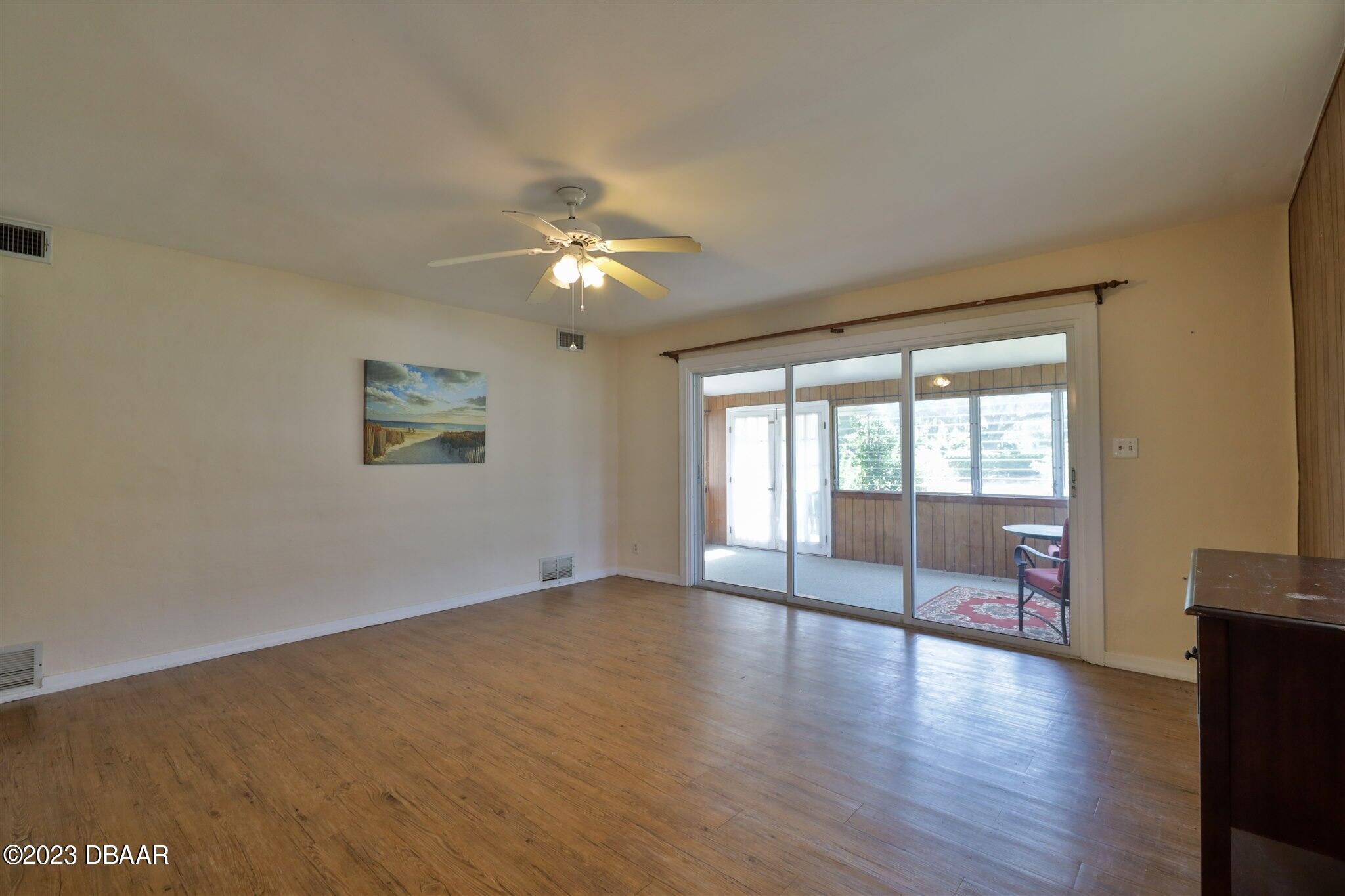 113 Evergreen Avenue Edgewater, FL 32132 - Photo 12 of 47 a view of an empty room with a window