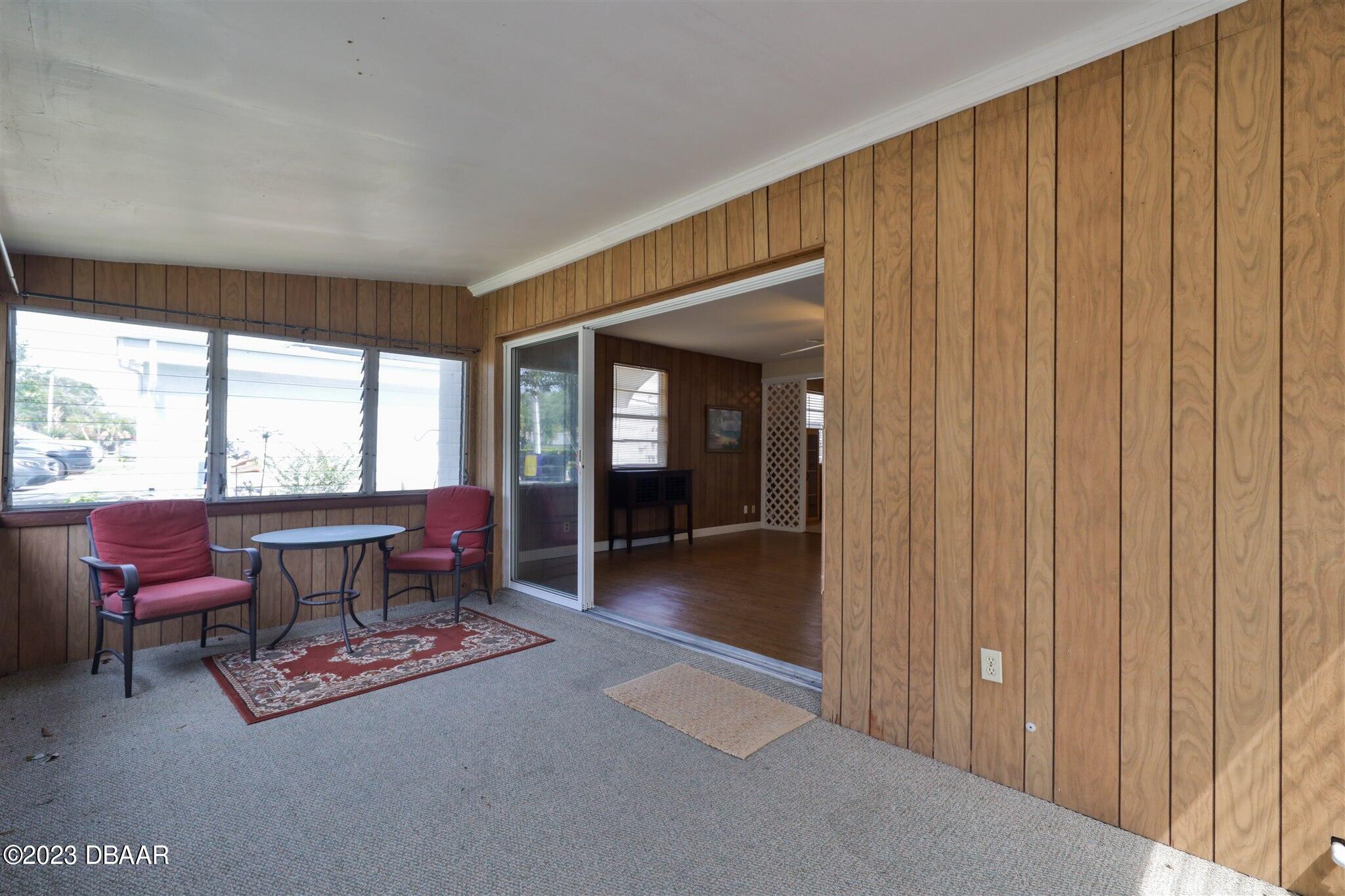 113 Evergreen Avenue Edgewater, FL 32132 - Photo 15 of 47 a living room with furniture and a gate