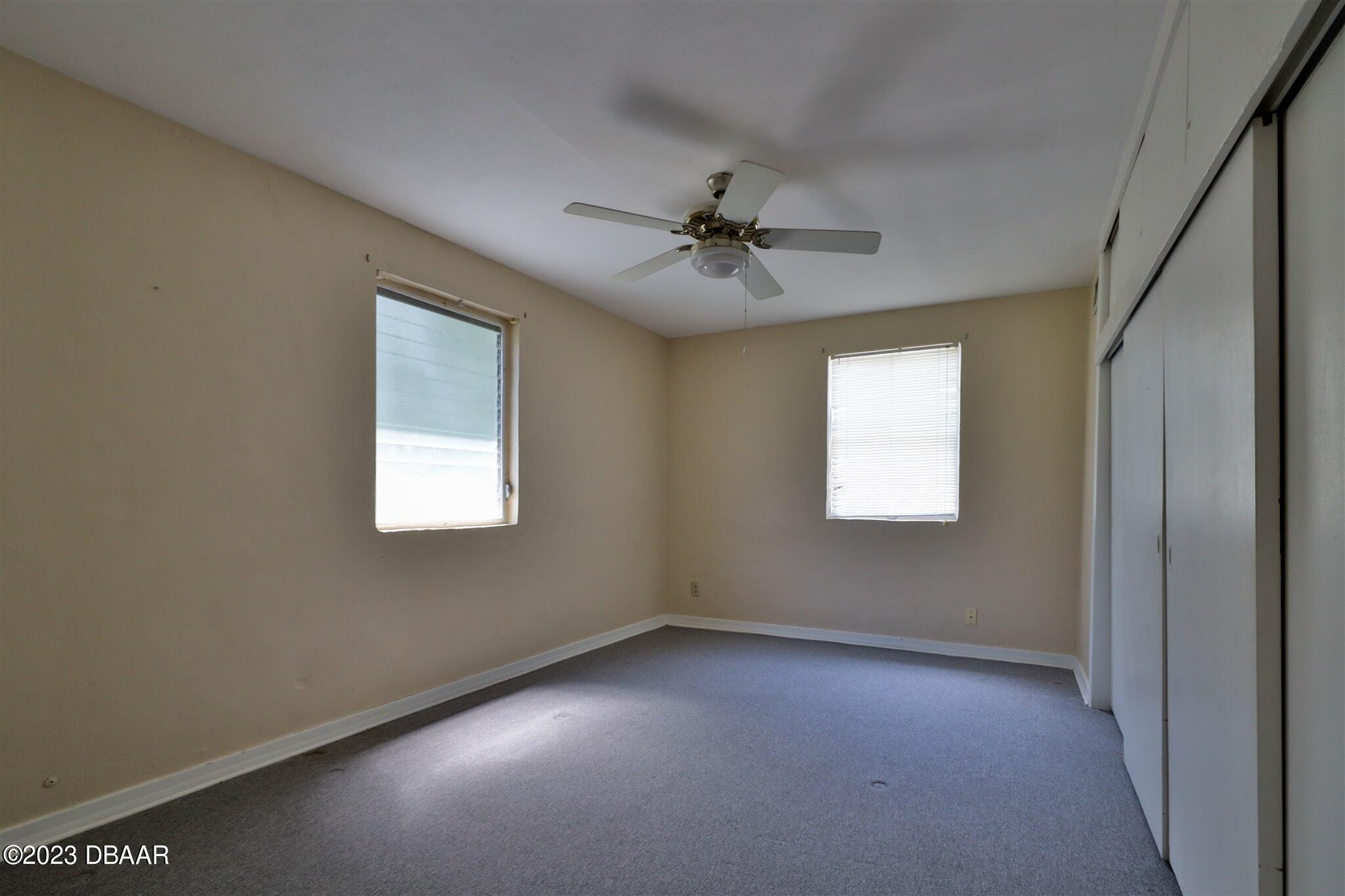 113 Evergreen Avenue Edgewater, FL 32132 - Photo 18 of 47 a view of an empty room with a window