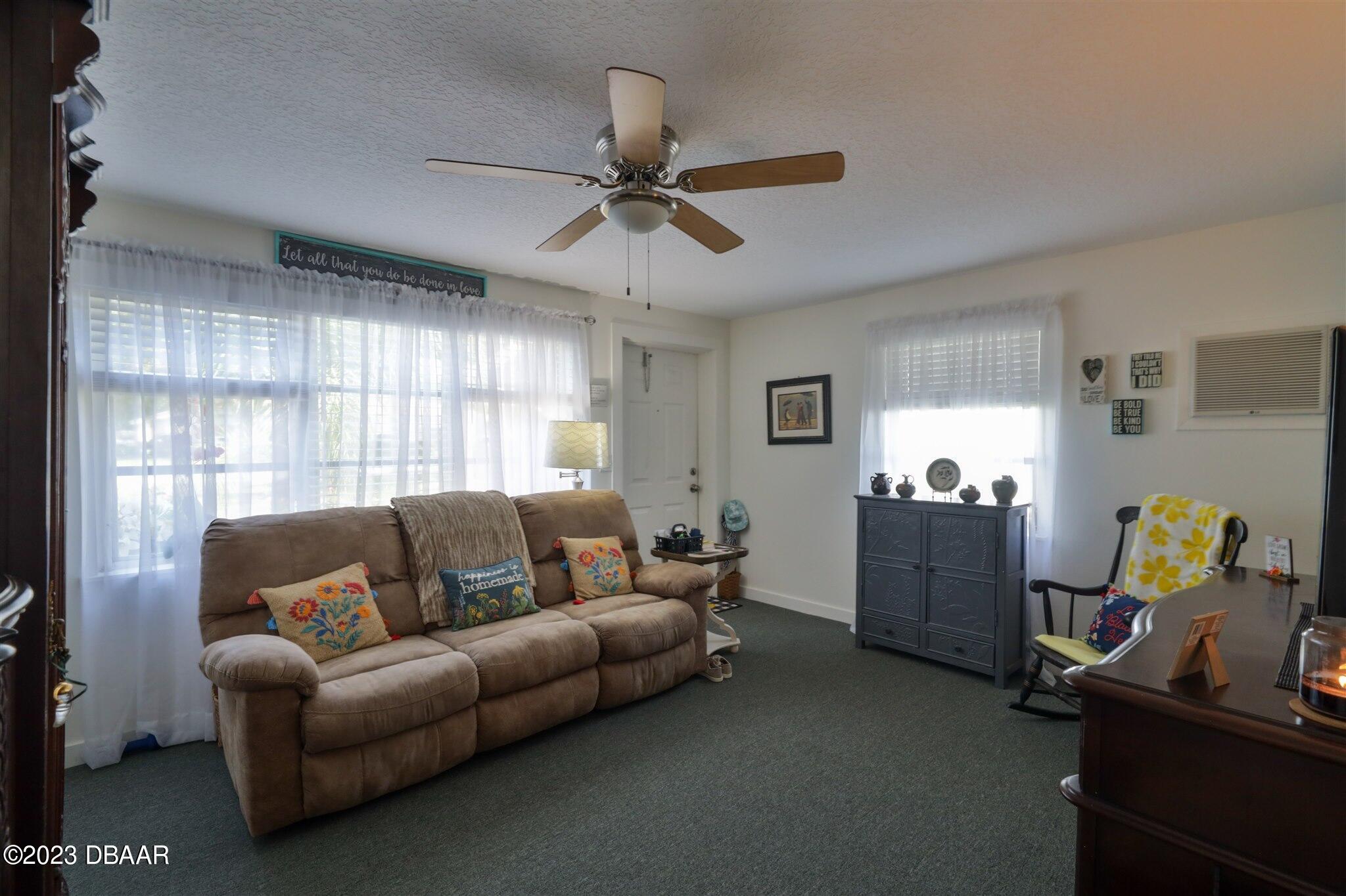 113 Evergreen Avenue Edgewater, FL 32132 - Photo 24 of 47 a living room with furniture and a window