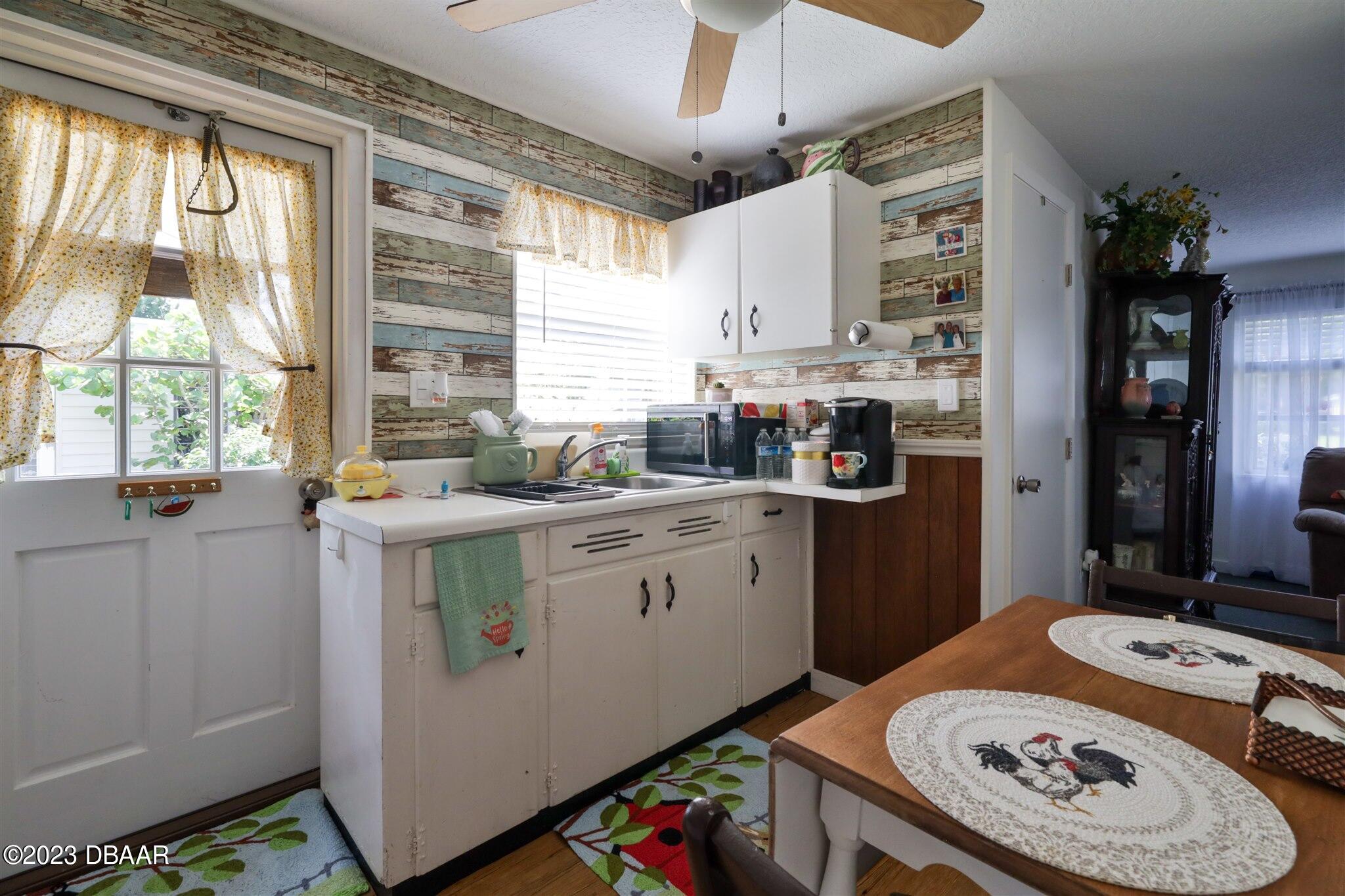 113 Evergreen Avenue Edgewater, FL 32132 - Photo 29 of 47 a kitchen with a sink stove and refrigerator