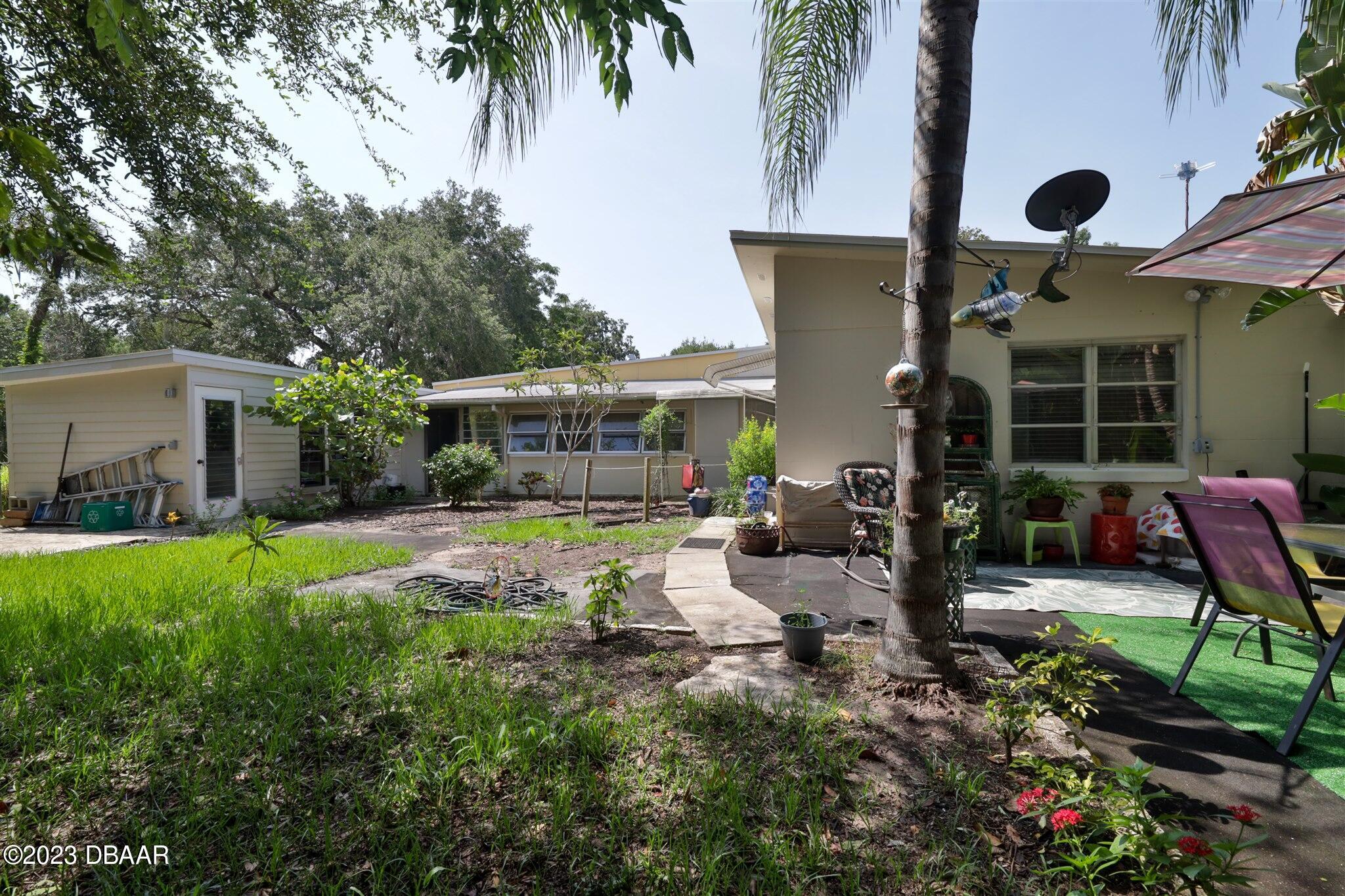 113 Evergreen Avenue Edgewater, FL 32132 - Photo 36 of 47 a view of a house with backyard and sitting area