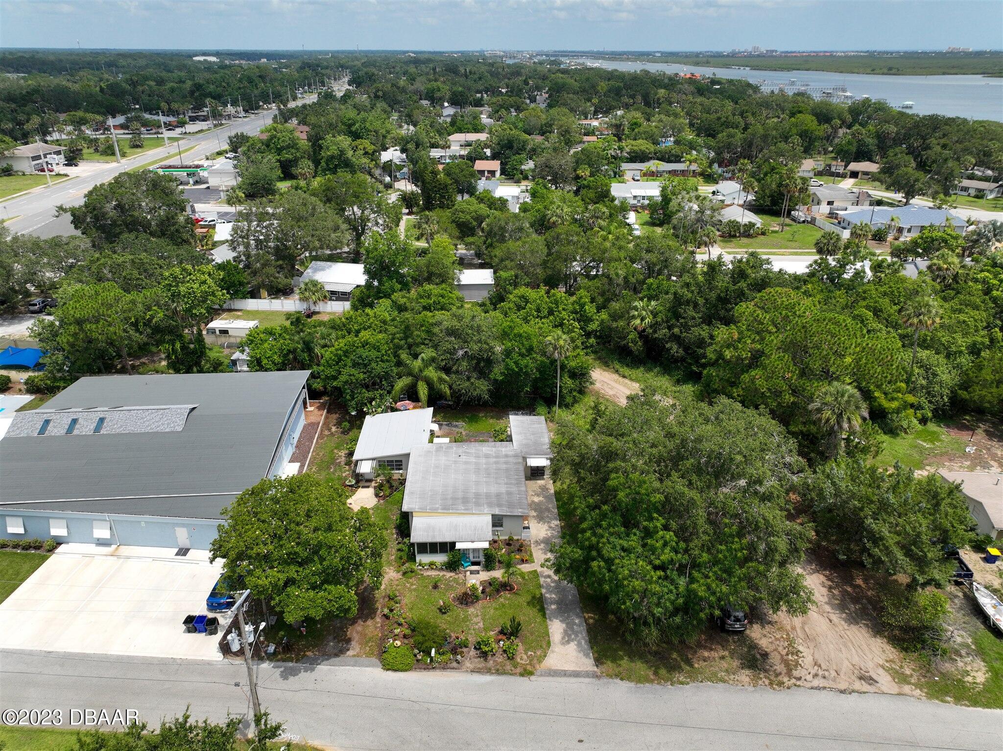 113 Evergreen Avenue Edgewater, FL 32132 - Photo 44 of 47 an aerial view of residential houses with outdoor space and trees