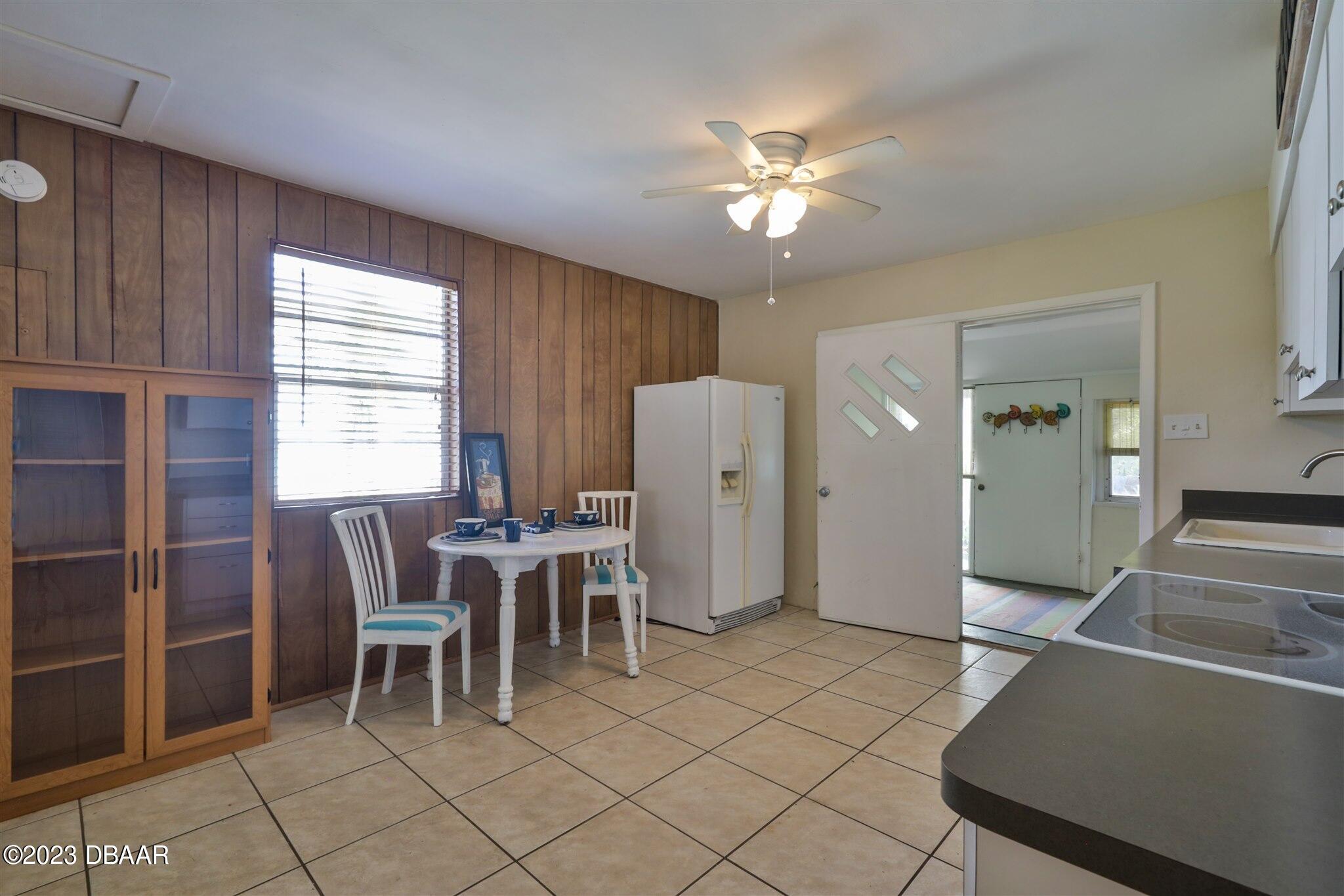 113 Evergreen Avenue Edgewater, FL 32132 - Photo 8 of 47 a view of a dining room with furniture and chandelier