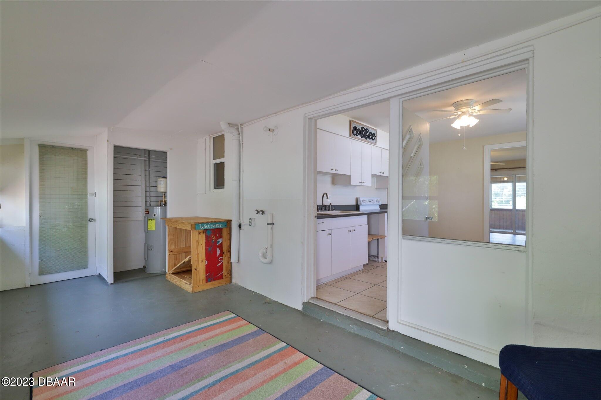 113 Evergreen Avenue Edgewater, FL 32132 - Photo 10 of 47 a living room with furniture and a open kitchen view