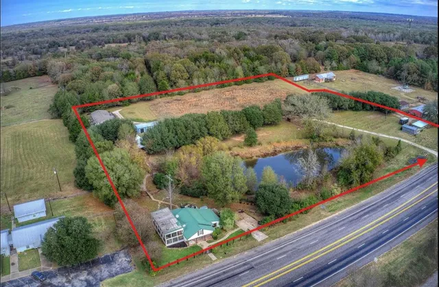 an aerial view of residential houses with outdoor space