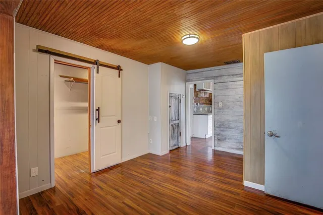 an aerial view of a house with a garden and a yard