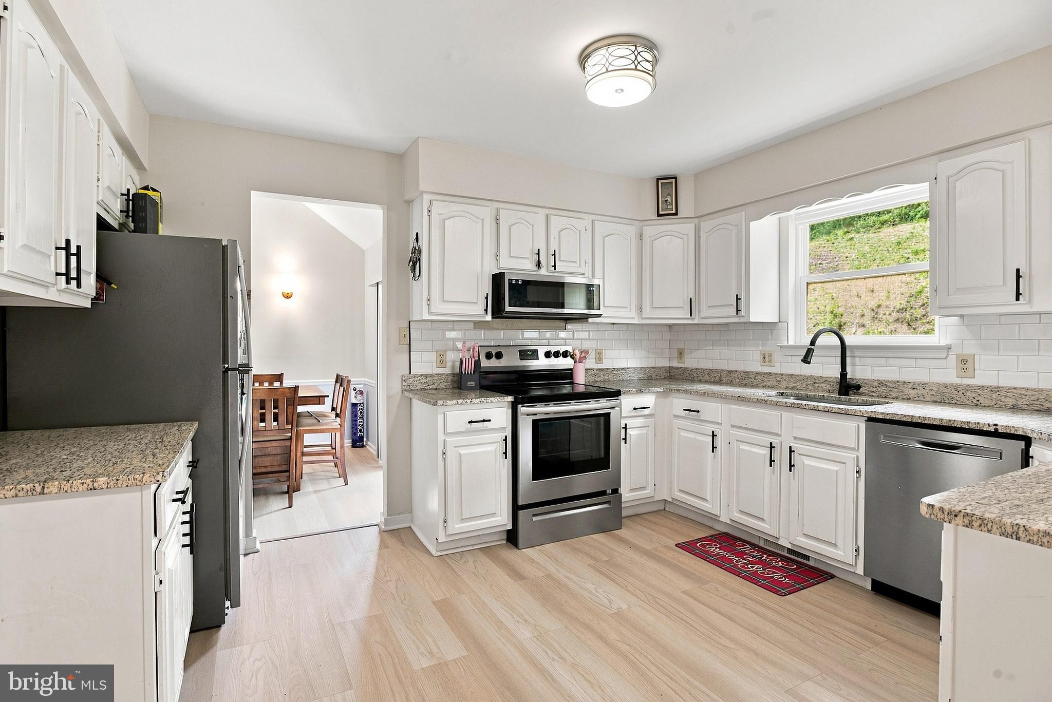 102 Mason Runn Lane Rising Sun, MD 21911 - Photo 12 of 32 Modern kitchen open to dining area-all appliances