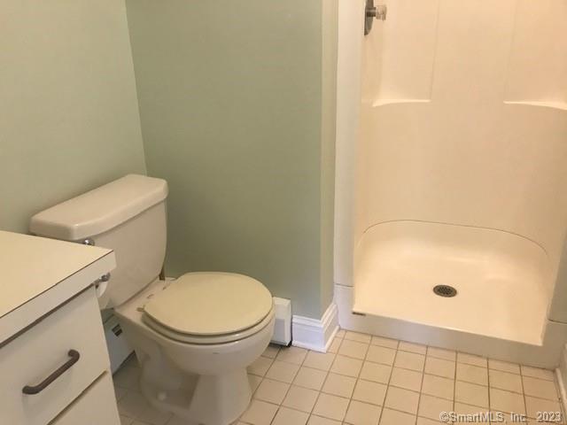 19 Greenfield Avenue Ridgefield, CT 06877 - Photo 23 of 28 a bathroom with a toilet and a shower