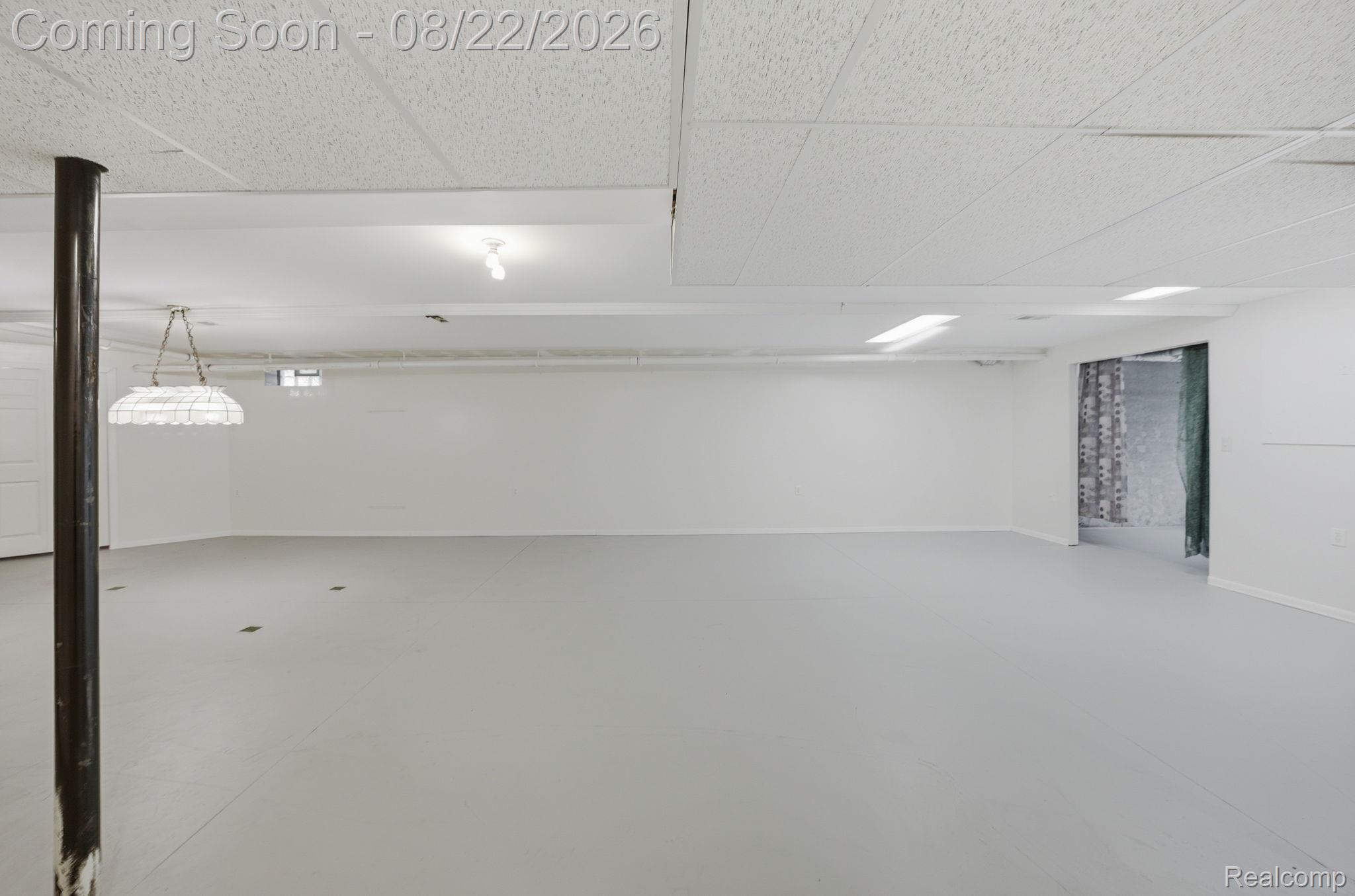 1301 Palms Road Columbus, MI 48063 - Photo 43 of 51 Expansive unfinished space with a suspended ceiling and painted concrete flooring
